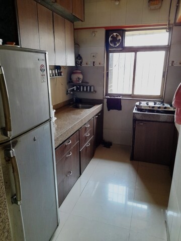 Kitchen in 2 BHK Apartment at Iris CHS, Kasarvadavali – for Sale