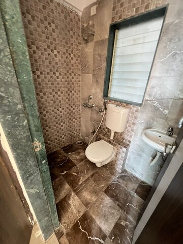 Bathroom in 1 BHK Apartment at Mohan Willows, Badlapur East – for Rent