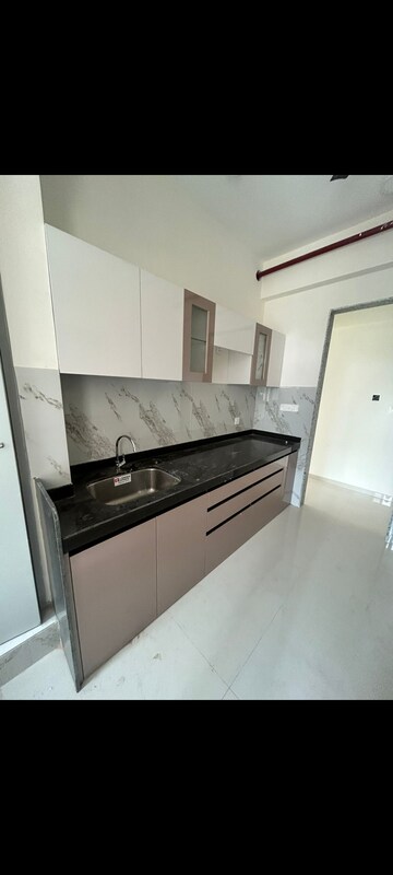 Kitchen in 2 BHK Apartment at Shapoorji Pallonji Alpine, Kandivali East – for Rent