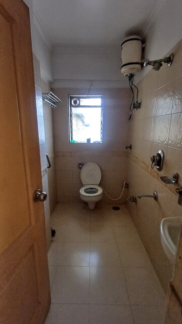 Bathroom in 3 BHK Apartment at Cosmos Tower, Majiwada – for Rent