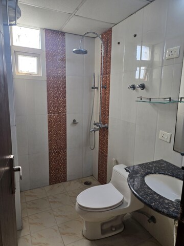 Bathroom in 4 BHK Apartment at Saya Gold Avenue, Vaibhav Khand – for Rent