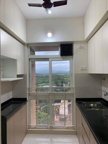 Kitchen in 1 BHK Apartment at Puranik Aarambh, Ghodbunder Road – for Rent