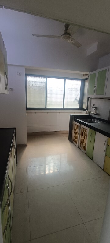 Kitchen in 3 BHK Apartment at Soham Garden, Manpada – for Rent