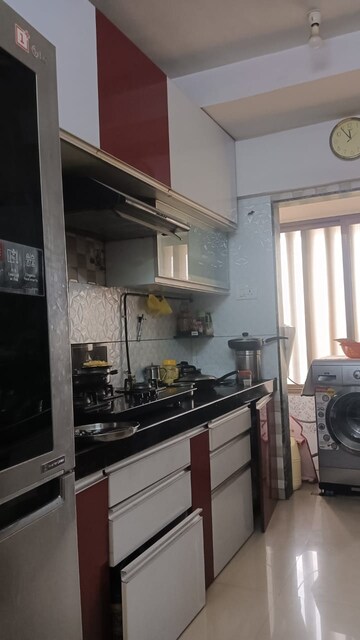 Kitchen in 3 BHK Apartment at Om Sai Charan CHS, Borivali West – for Sale
