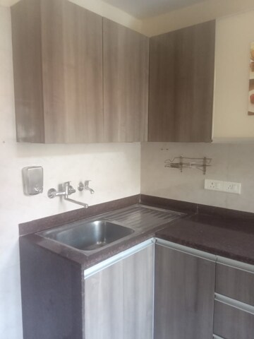 Kitchen in 2 BHK Apartment at Unitech Woodstock Floors, Sector 50 – for Rent
