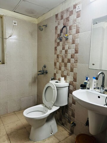 Bathroom in 2.5 BHK Apartment at Amrapali Princely Estate, Sector 76 – for Sale
