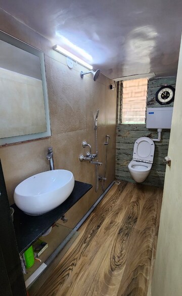 Bathroom in 1 BHK Apartment at New Dinkar Housing Cooperative Society – for Rent