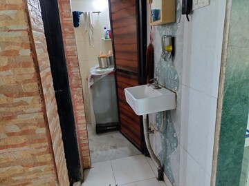 Bathroom in 1 BHK Apartment at Brahmand CHS, Brahmand – for Sale