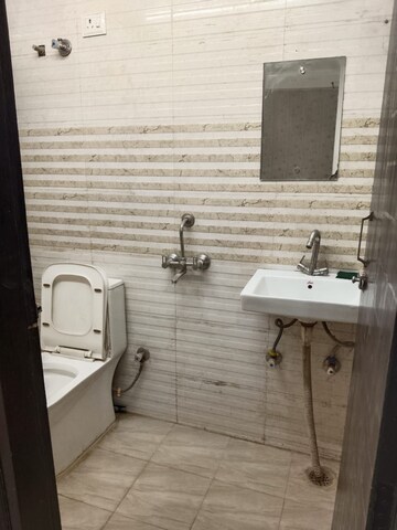 Bathroom in 1.5 BHK Apartment at Savitri Nagar – for Sale