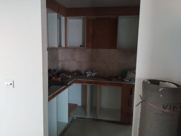 Kitchen in 3 BHK Apartment at Mahagun Mywoods, Sector 16c Greater Noida – for Rent