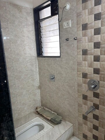 Bathroom in 2 BHK Apartment at Shree Sai Surya Kiran, Andheri West – for Rent