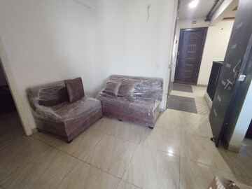 Living Room in 2 BHK Apartment at Aims Golf City, Sector 75 – for Rent