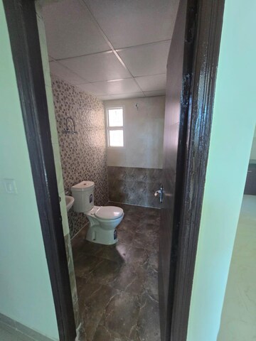 Bathroom in 3 BHK Apartment at JKG Palm Court, Sector 16c Greater Noida – for Rent
