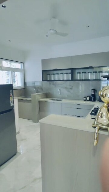 Kitchen in 3 BHK Apartment at Kohinoor Woodshire, Bhugaon – for Sale