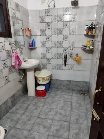Bathroom in 3 BHK Apartment at Dhakoli Village – for Sale