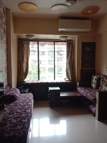 Living Room in 1 BHK Apartment at Kopar Khairane – for Sale