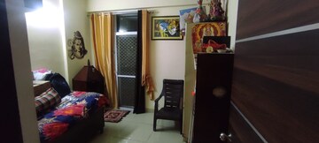 Living Room in 2.5 BHK Apartment at Aims Golf City, Sector 75 – for Rent