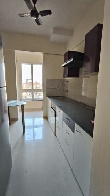 Kitchen in 2 BHK Apartment at Puranik Rumah Bali, Ghodbunder Road – for Sale
