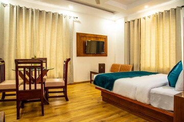 Living Room in 1 BHK Apartment at K Raheja Palm Court, Malad West – for Rent