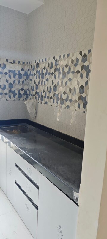 Kitchen in 1 BHK Apartment at Raunak Bliss B1, Ghodbunder Road – for Rent