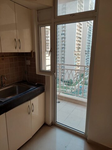 Kitchen in 3 BHK Apartment at Mahagun Mywoods, Sector 16c Greater Noida – for Rent