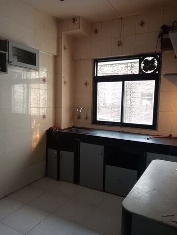 Kitchen in 2 BHK Apartment at Om Gokul Nagari CHS, Kandivali East – for Rent