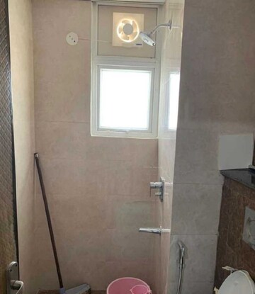Bathroom in 2 BHK Apartment at Paradigm Business Hermitage Park, Dhakoli Village – for Rent