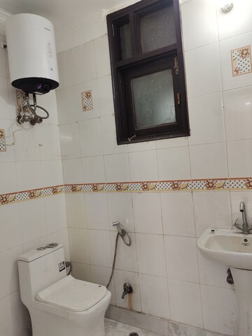 Bathroom in 3 BHK Builder Floor at Freedom Fighters Enclave – for Rent