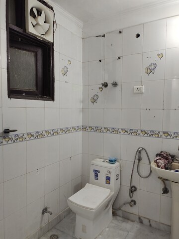 Bathroom in 3 BHK Builder Floor at Freedom Fighters Enclave – for Rent