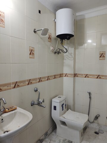 Bathroom in 3 BHK Builder Floor at Freedom Fighters Enclave – for Rent
