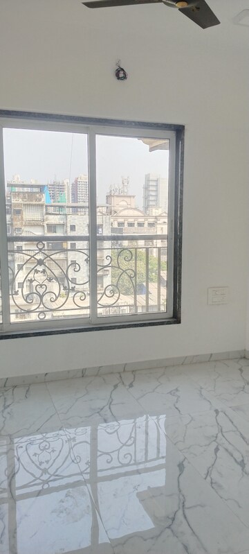 Bedroom in 3 BHK Apartment at New Happy Life CHS, Mulund West – for Sale
