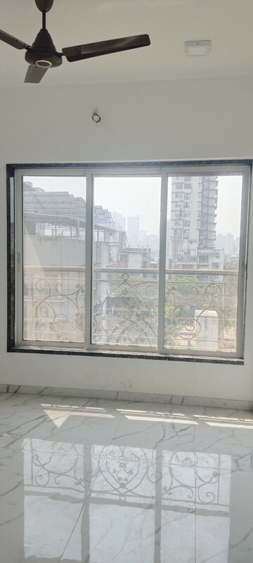 Bedroom in 3 BHK Apartment at New Happy Life CHS, Mulund West – for Sale
