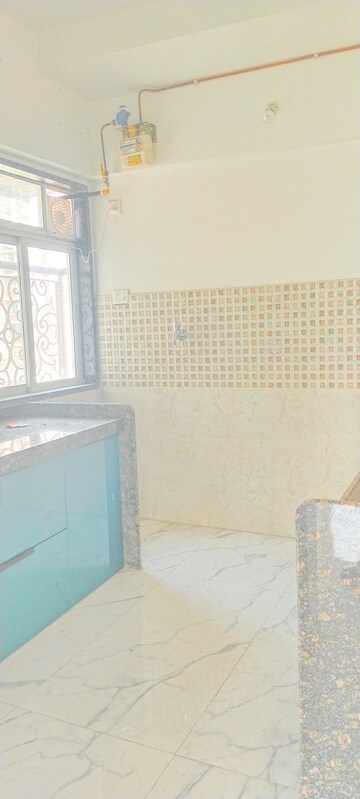 Kitchen in 3 BHK Apartment at New Happy Life CHS, Mulund West – for Sale