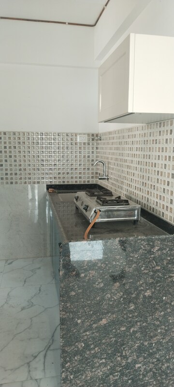 Kitchen in 3 BHK Apartment at New Happy Life CHS, Mulund West – for Sale