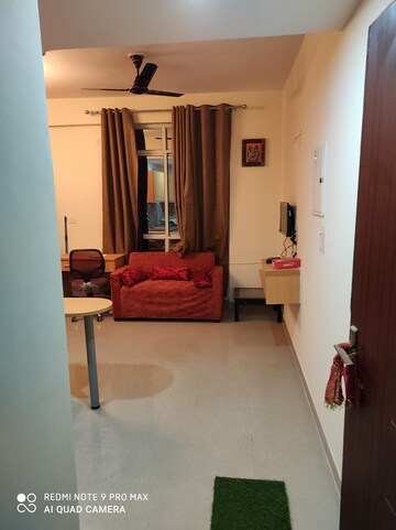 Living Room in Studio Apartment at Supertech Czar Suites, Omicron I Greater Noida – for Rent