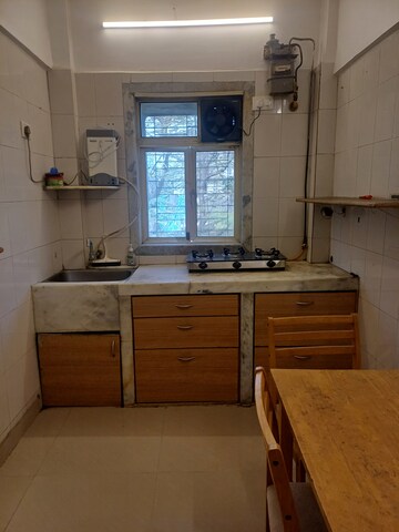 Kitchen in 1 BHK Apartment at Nandini CHS, Andheri West – for Rent