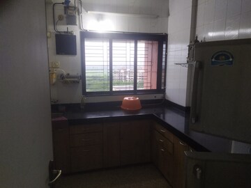 Kitchen in 2 BHK Apartment at Samartha Ashish CHS, Andheri West – for Sale