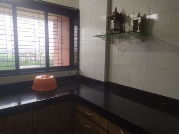 Kitchen in 2 BHK Apartment at Samartha Ashish CHS, Andheri West – for Sale