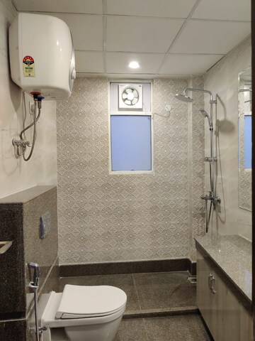 Bathroom in 2 BHK Apartment at Aims Golf City, Sector 75 – for Rent
