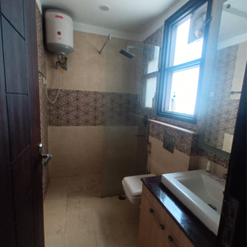 Bathroom in 3 BHK Builder Floor at Ansal API Esencia, Sector 67 – for Rent