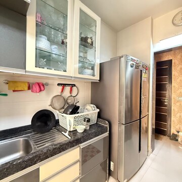 Kitchen in 2 BHK Apartment at Rustomjee Azziano Wing I, Vrindavan Society – for Sale