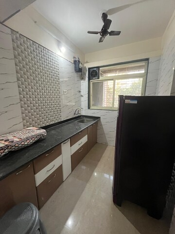 Kitchen in 2 BHK Apartment at Mohan Willows, Badlapur East – for Rent
