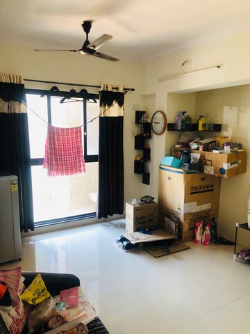 Living Room in 1 BHK Apartment at Raunak Heights, Ghodbunder Road – for Rent
