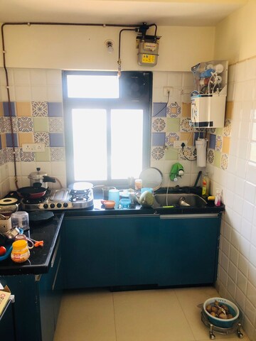 Kitchen in 1 BHK Apartment at Raunak Heights, Ghodbunder Road – for Rent