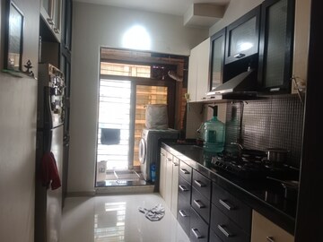 Kitchen in 2.5 BHK Apartment at Shree Satya Shankar Residency, Manpada – for Sale