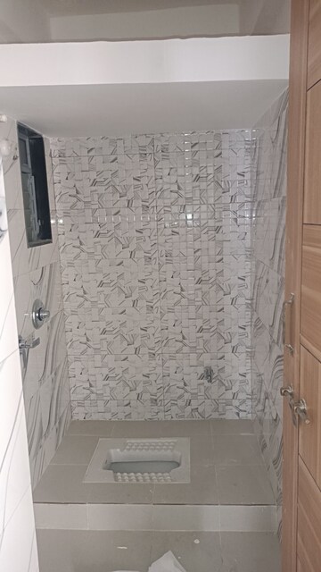 Bathroom in 1 BHK Apartment at Lodha Panacea Phase 2, Dombivli East – for Rent