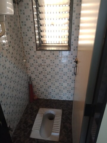 Bathroom in 1 BHK Apartment at Oshiwara Basera CHS, Andheri West – for Rent