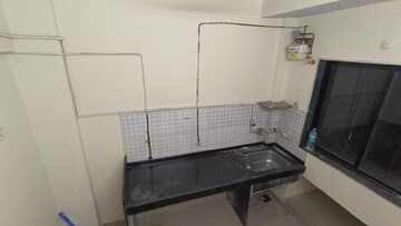 Kitchen in 1 BHK Apartment at Royal Palms, Goregaon East – for Rent
