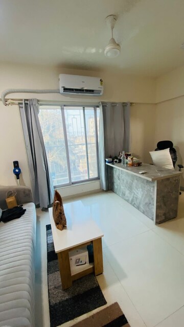 Living Room in 1 BHK Apartment at Bindra Complex, Andheri East – for Rent