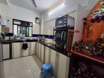 Kitchen in 2 BHK Apartment at Shiv krupa Swastik Society, Juhu – for Rent